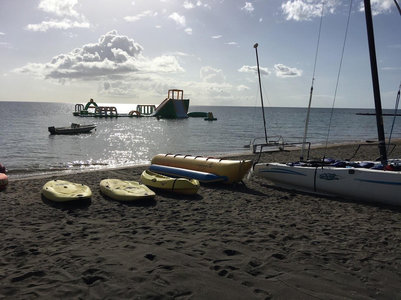 A view of the water slides and paddle boards on the shore of Coconut Beach in Dominica